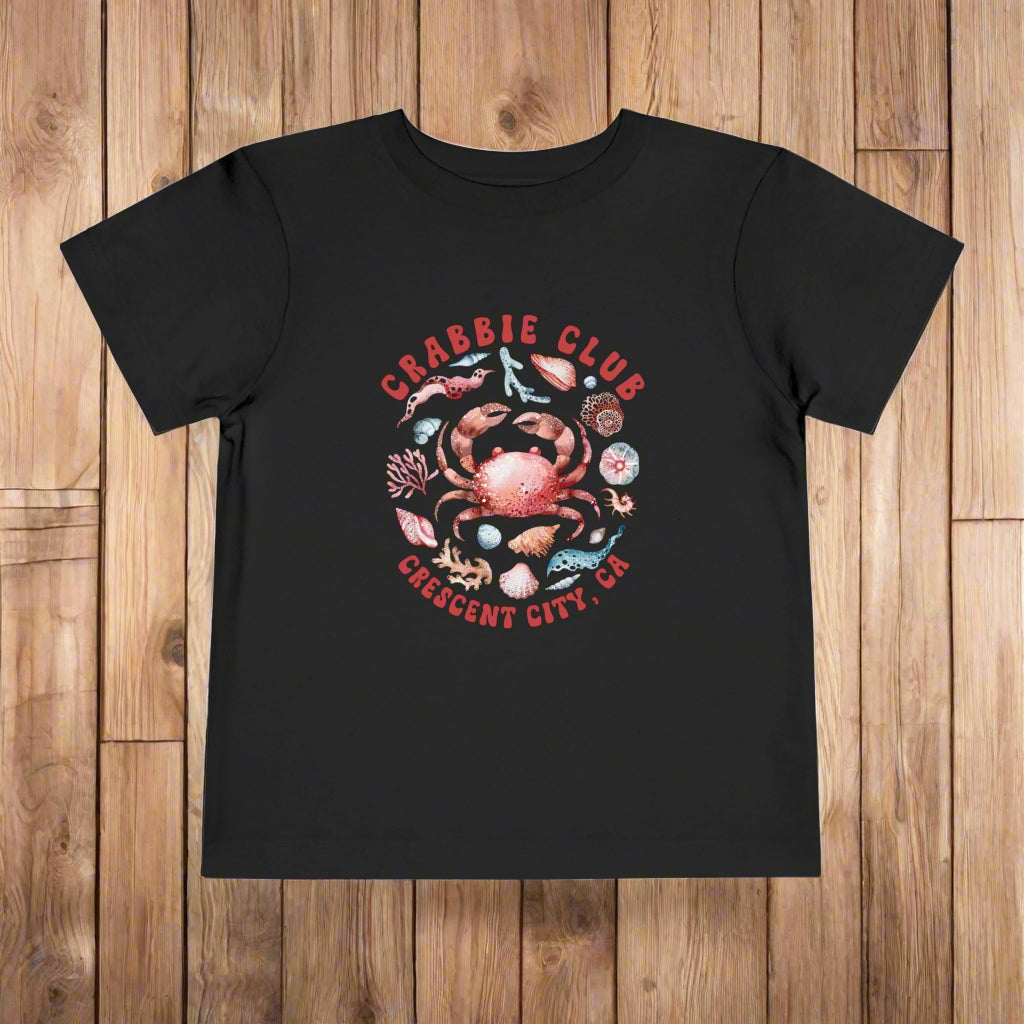 Black Toddler t-shirt with the phrase “Crabbie Club Crescent City, CA” and a playful cartoon crab graphic.