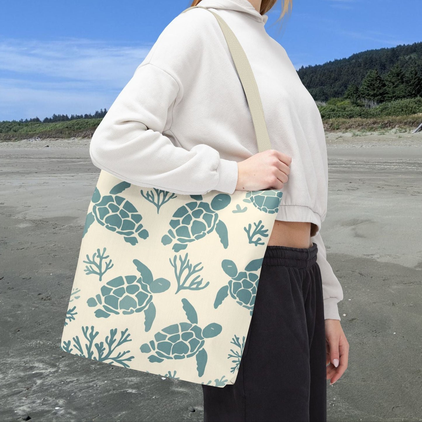 Natural beige 16" x 16" tote bag featuring sage green sea turtles in a repeating coastal pattern.