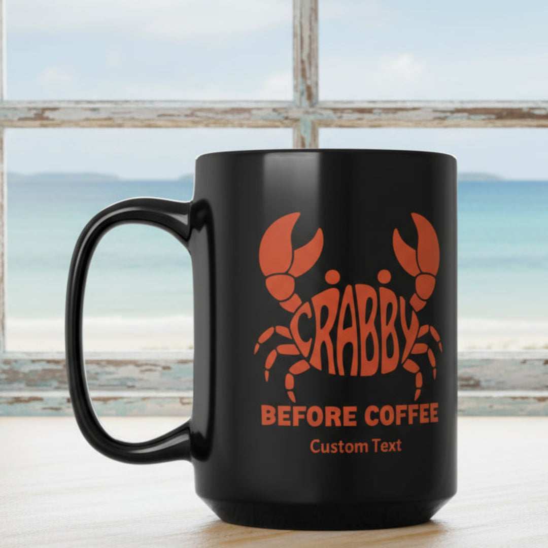 Black mug with red crab design that says Crabby Before Coffee that can be personalized.