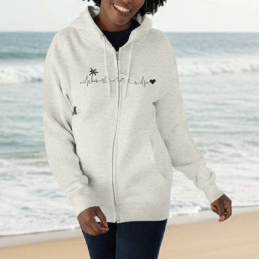 Person wearing a light gray hoodie with text and graphics on a light blue background