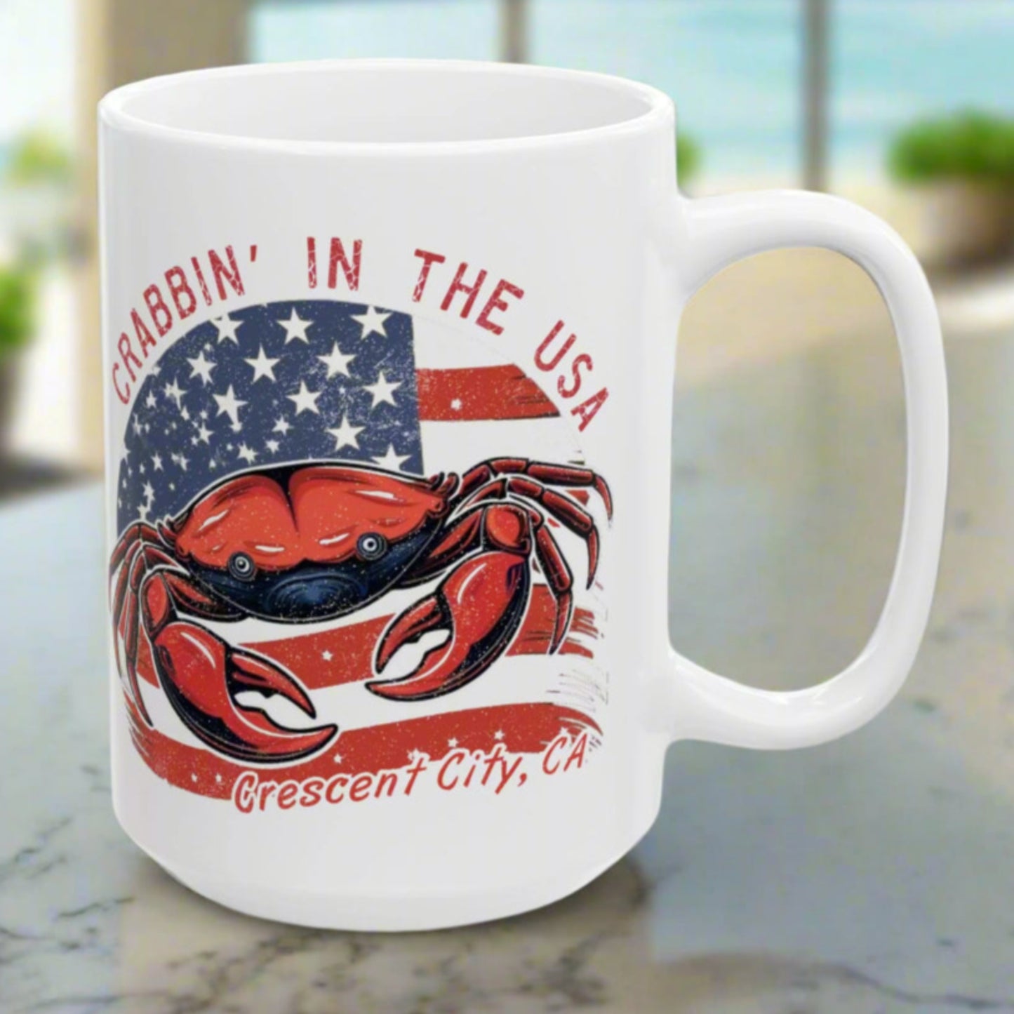 White mug with a red, white, and blue featuring a crab and American flag, with text 'Crabbin' in the USA Crescent City, CA'.