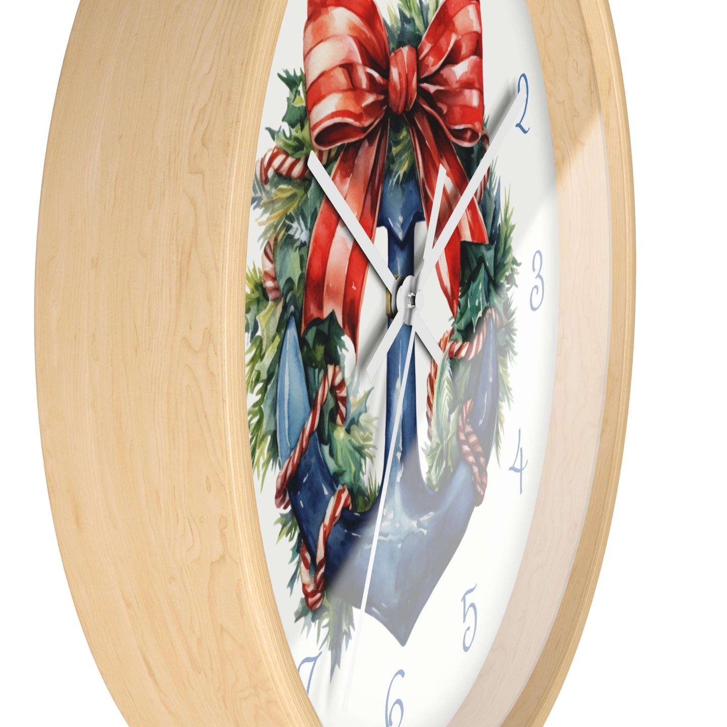 Wall clock with a decorative design of a red bow and greenery on a white background