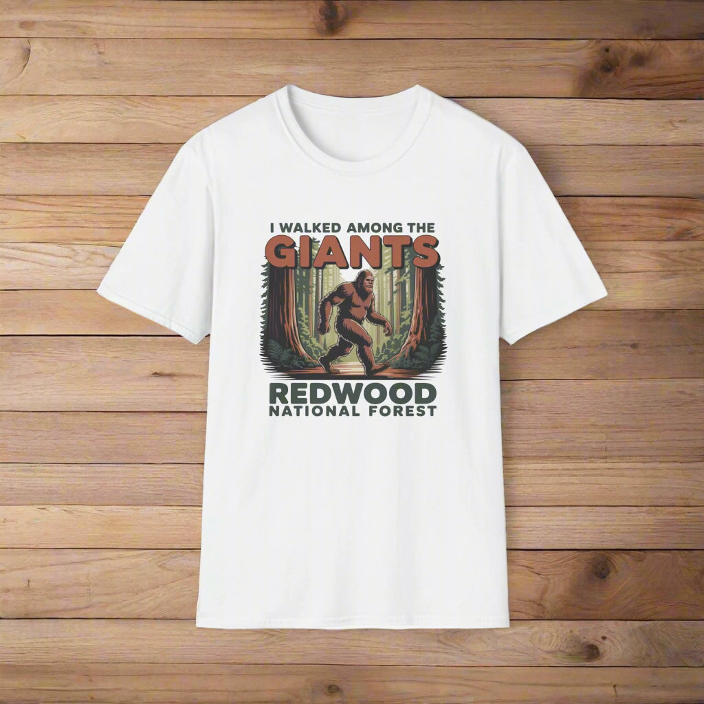 White t-shirt with a graphic of a bigfoot and text about Redwood National Forest on a white background