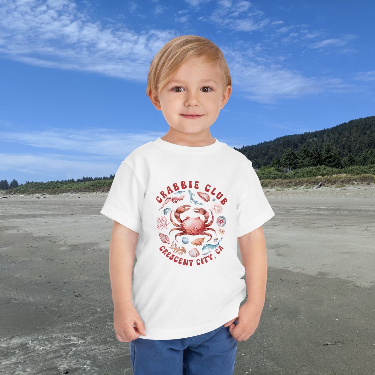 White Toddler t-shirt with the phrase “Crabbie Club Crescent City, CA” and a playful cartoon crab graphic.