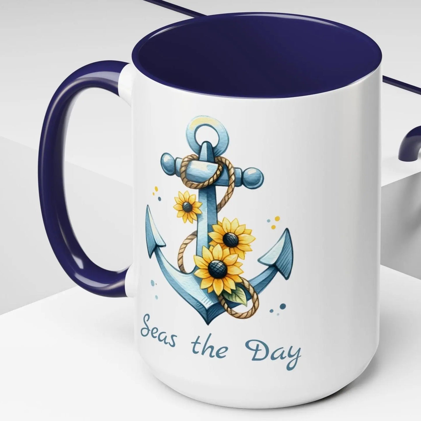 15 oz White mug with blue handle and interior with Anchor and Sunflowers with text Seas the Day
