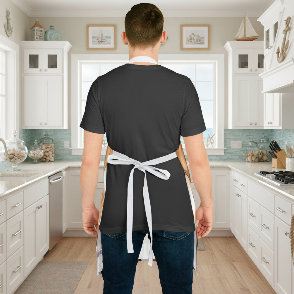 Person wearing a dark gray apron with a white apron over it on a white background
