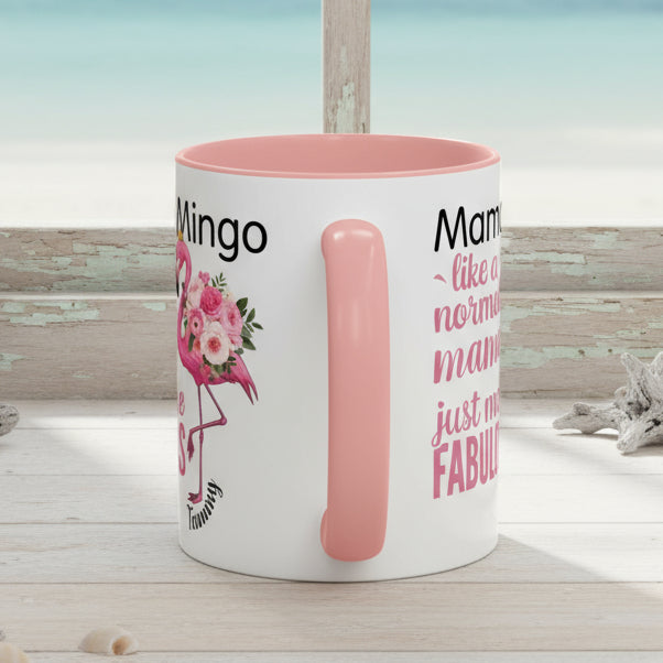White mug with pink interior and handle, featuring text and graphics on a white background