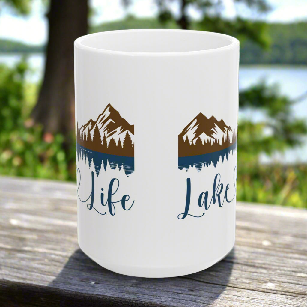 Side view of White 15 oz. ceramic mug with mountain and lake reflection design, featuring the phrase “Lake Life” – perfect for nature lovers.