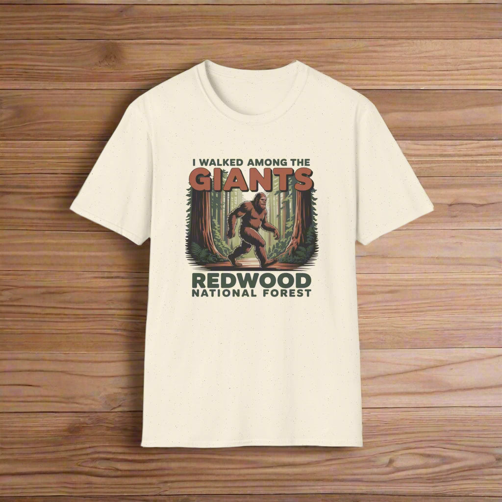 Beige t-shirt with a graphic of a bear and text about Redwood National Forest on a white background