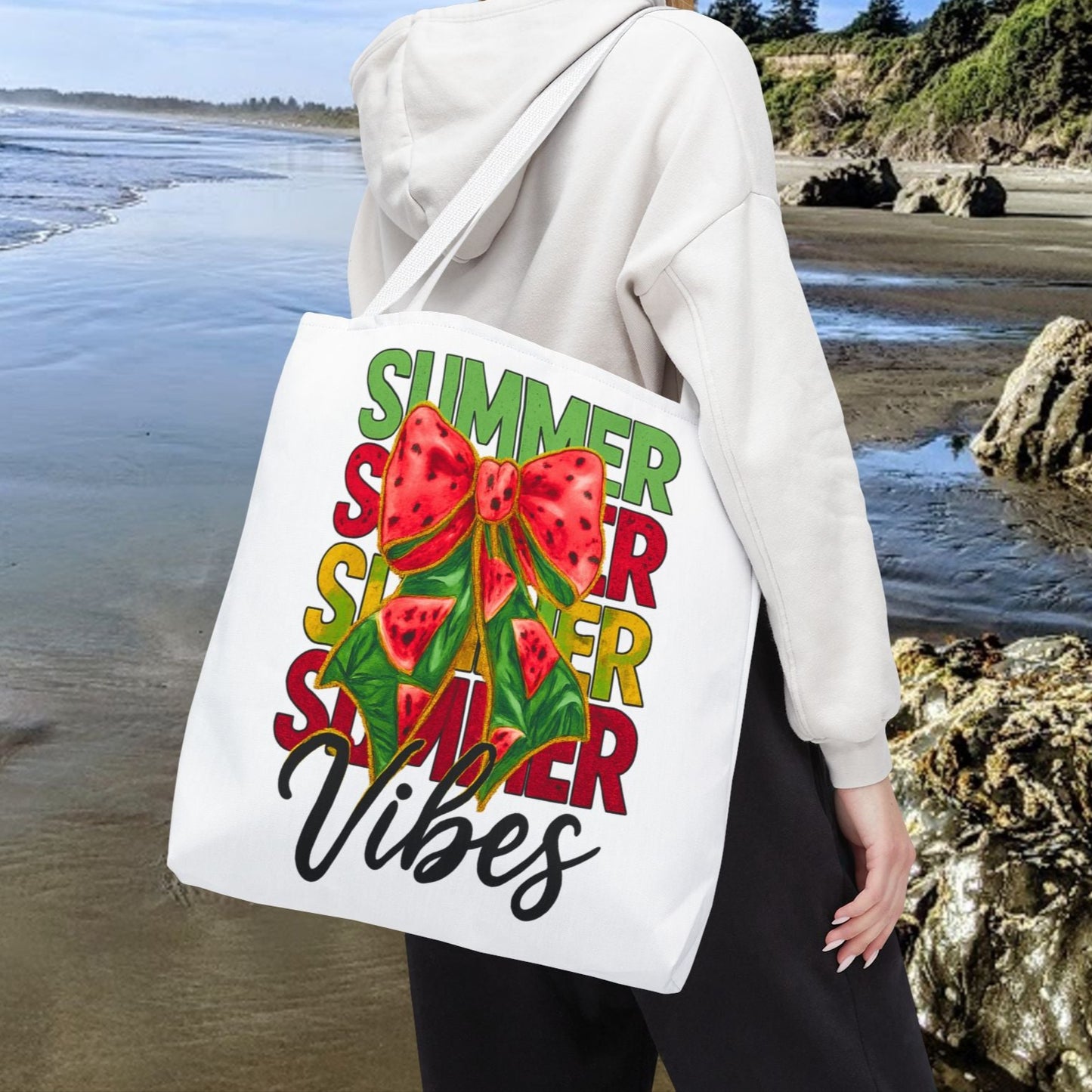 White 18" x 18" tote bag with the word "Summer" repeated in green, red, and yellow, featuring a coquette-style bow, watermelon illustrations, and the word "Vibes" underneath.