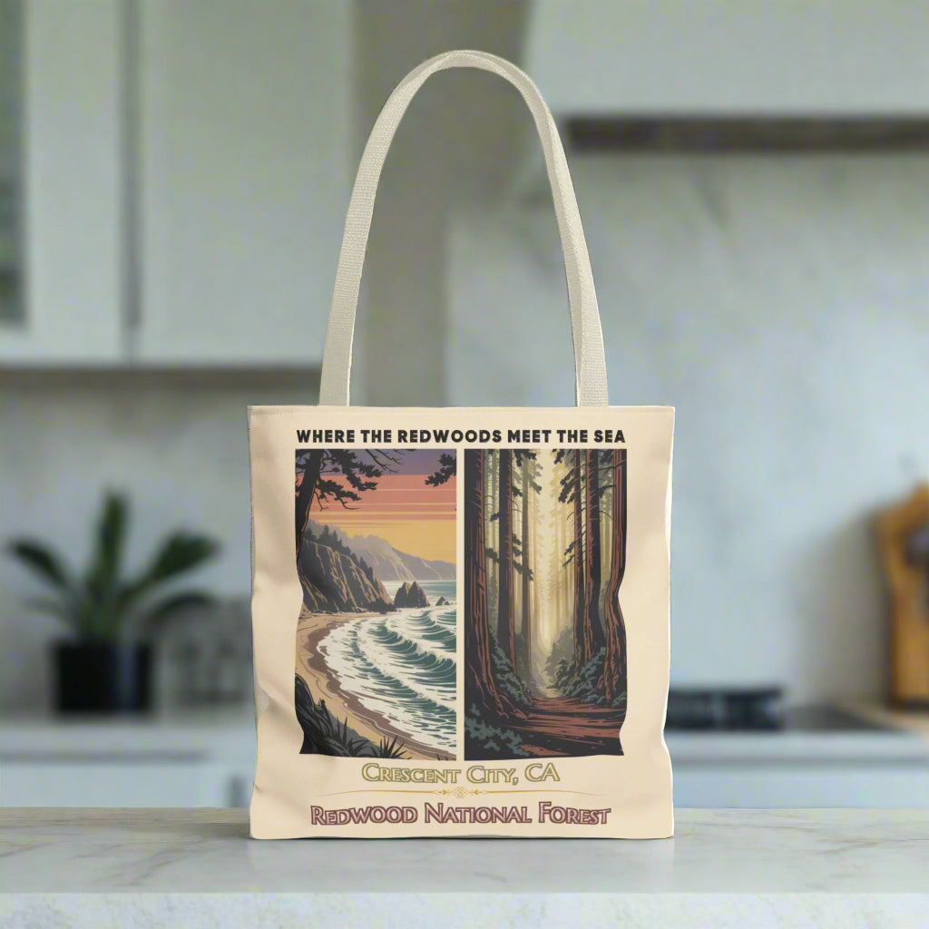 Beige 16" x 16" Tote bag with a double-panel design featuring the redwood forest and the Northern California coastline, with the text “Where the Redwoods Meet the Sea” and “Crescent City, CA Redwood National Forest” underneath.