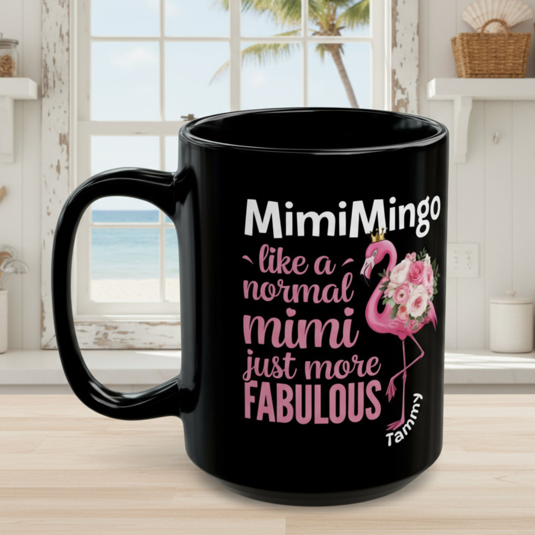 Black mug with pink flamingo and text on a white background