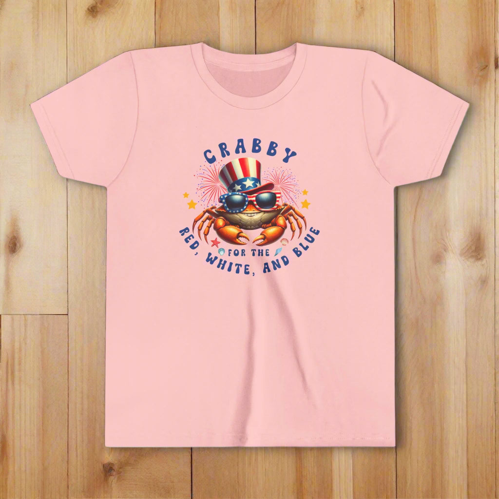 Pink t-shirt with a crab graphic and text on a white background