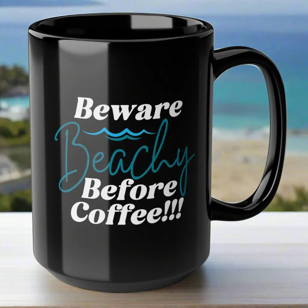 Black 15 oz. coffee mug that says Beware Beachy Before coffee with wave image.