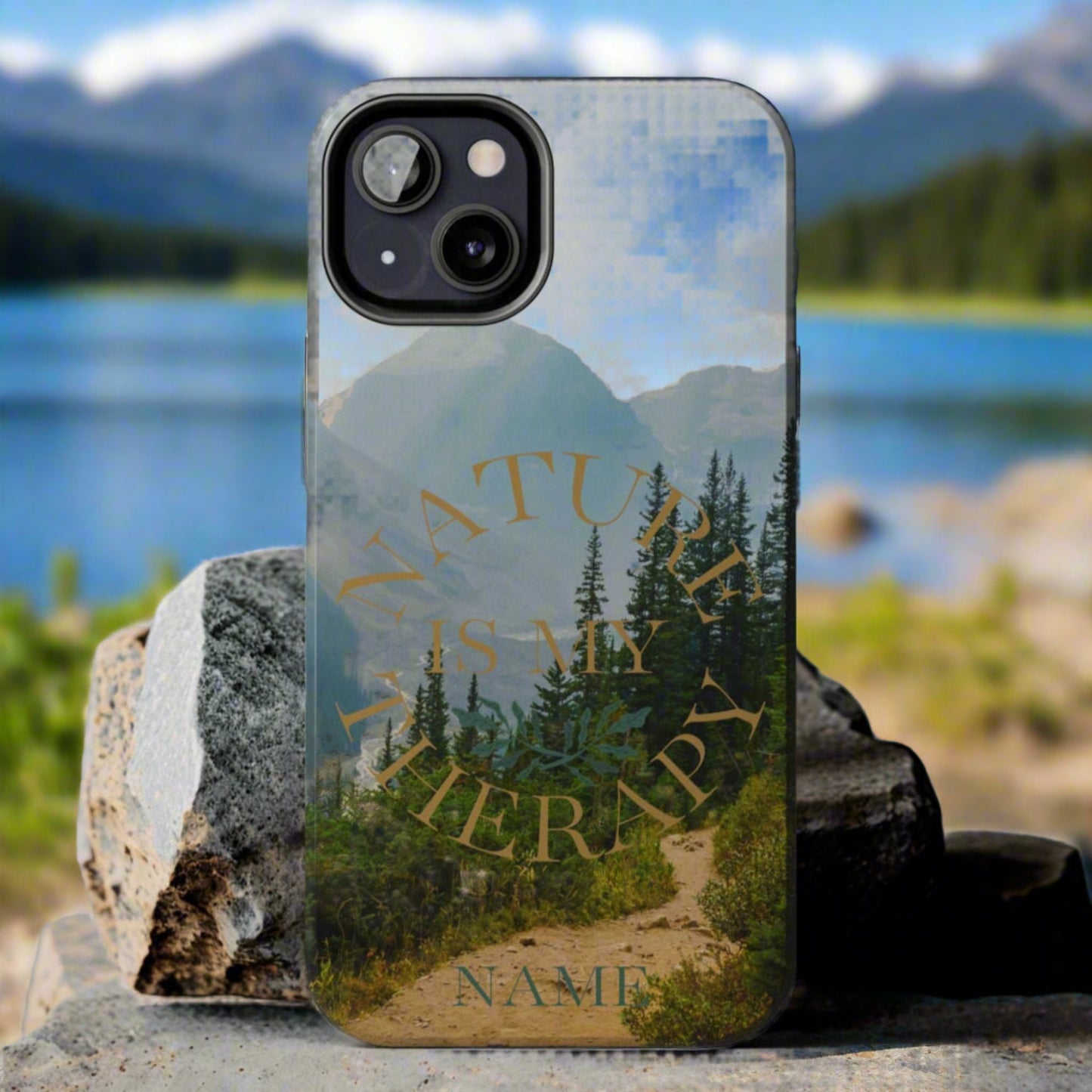 Phone case with nature design and 'Nature is my therapy' text on a rock