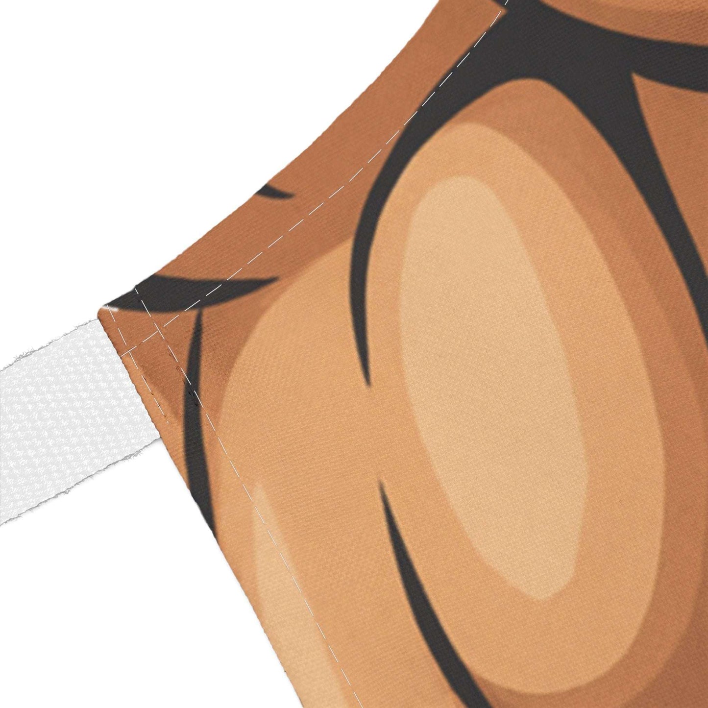 Close-up of a brown fabric with black abstract patterns on a white background