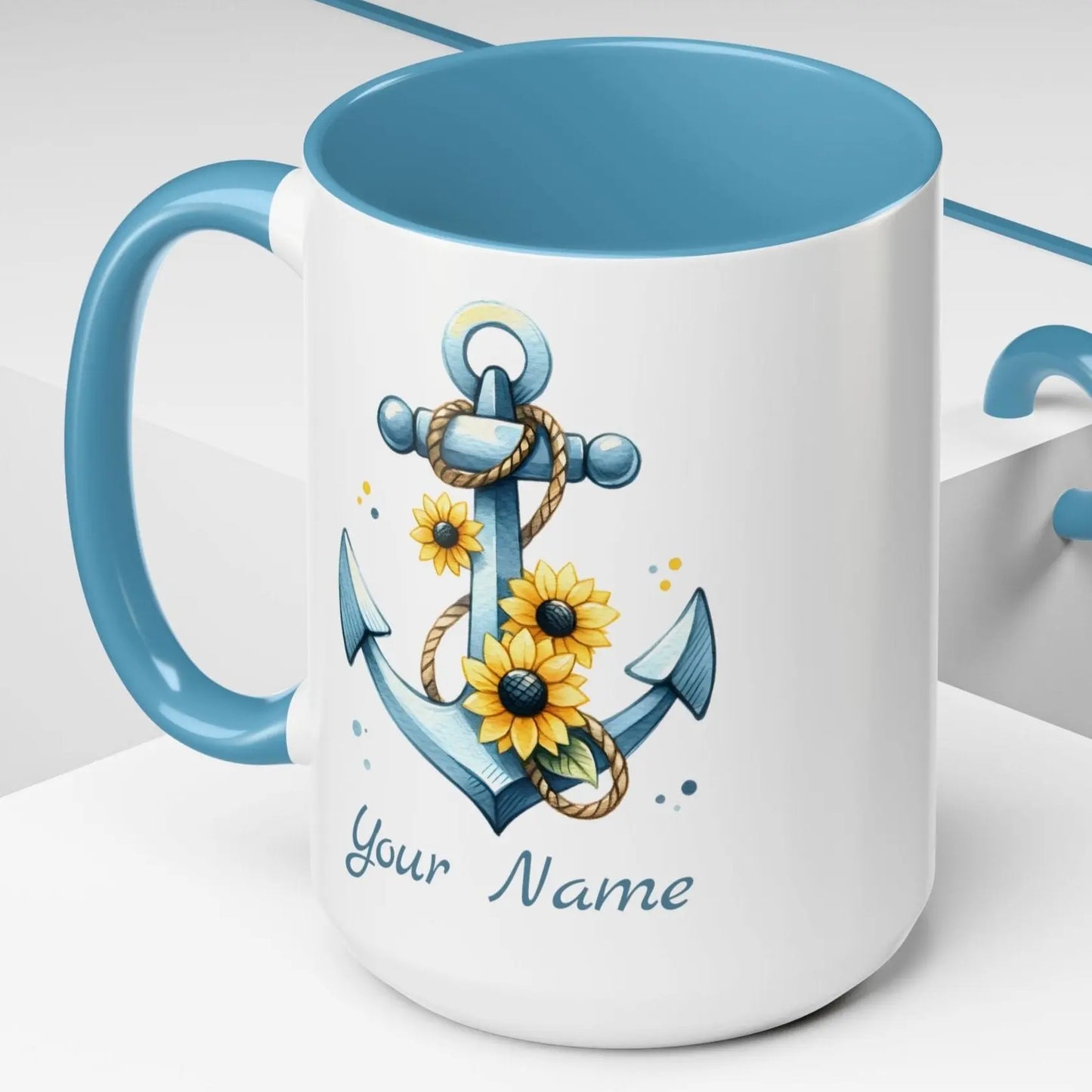 15 oz White mug with baby blue handle and interior with Anchor and Sunflowers with text Seas the Day