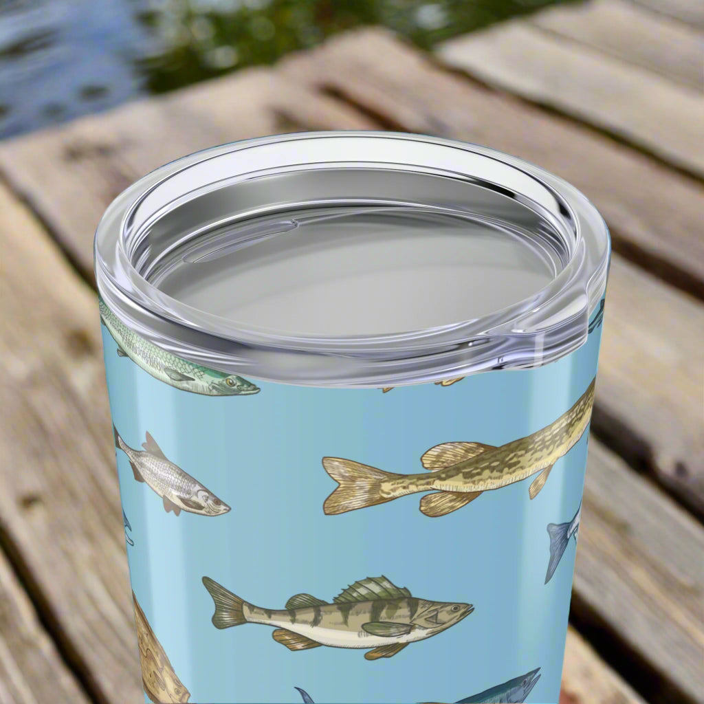 Close up of lid on our 20oz stainless steel tumbler with blue background featuring realistic fish design, glossy finish, and spill-resistant lid.