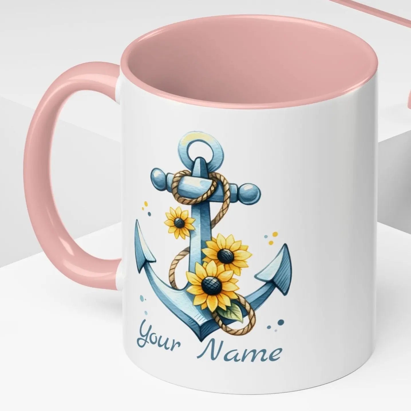 11 oz White mug with pink handle and interior with Anchor and Sunflowers with text Seas the Day