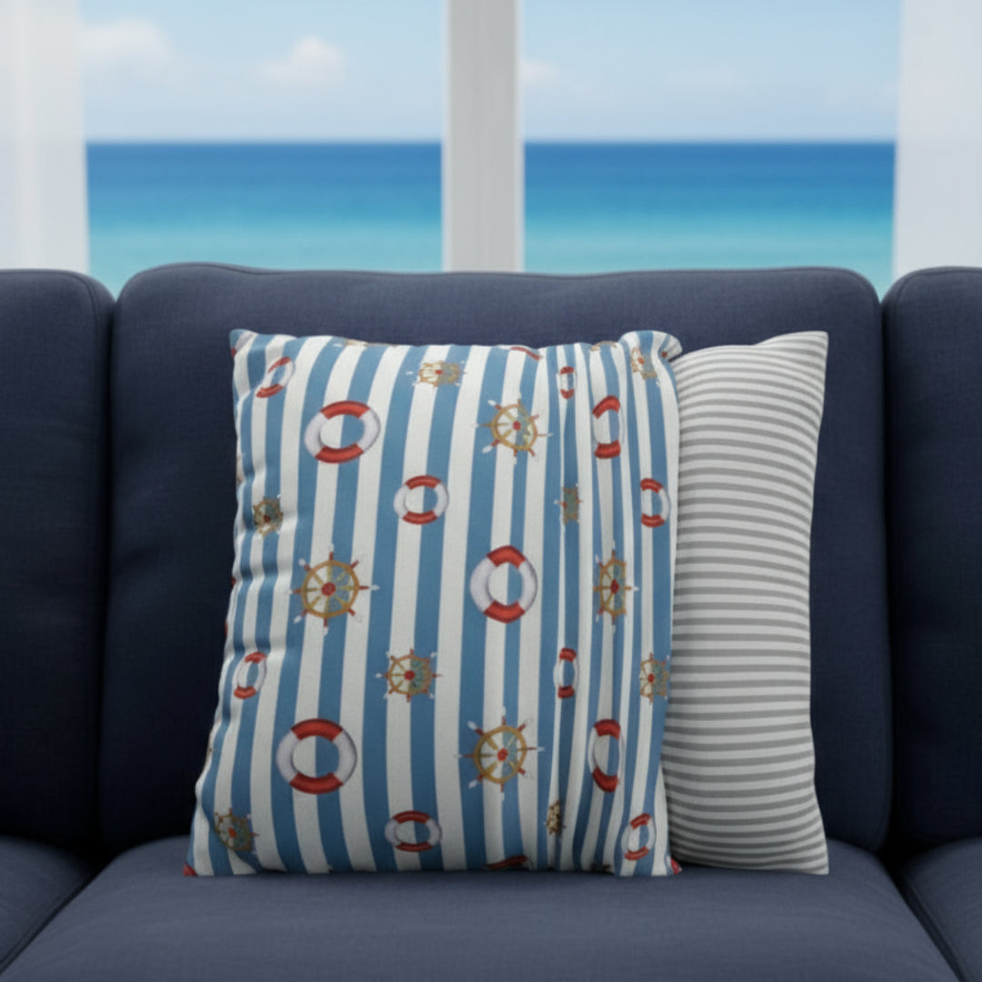 Decorative pillow with nautical patterns showing the ease of removal.