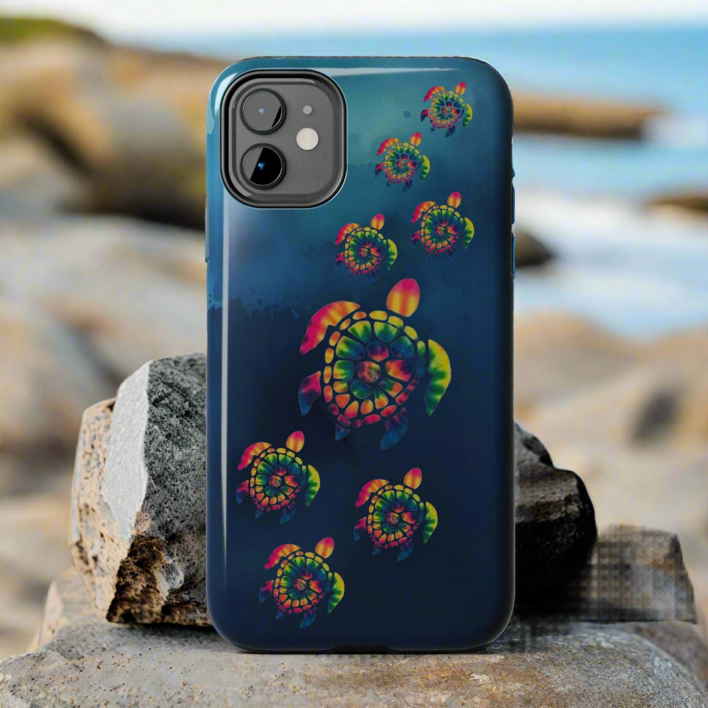 Phone case with colorful turtle design on a gray background