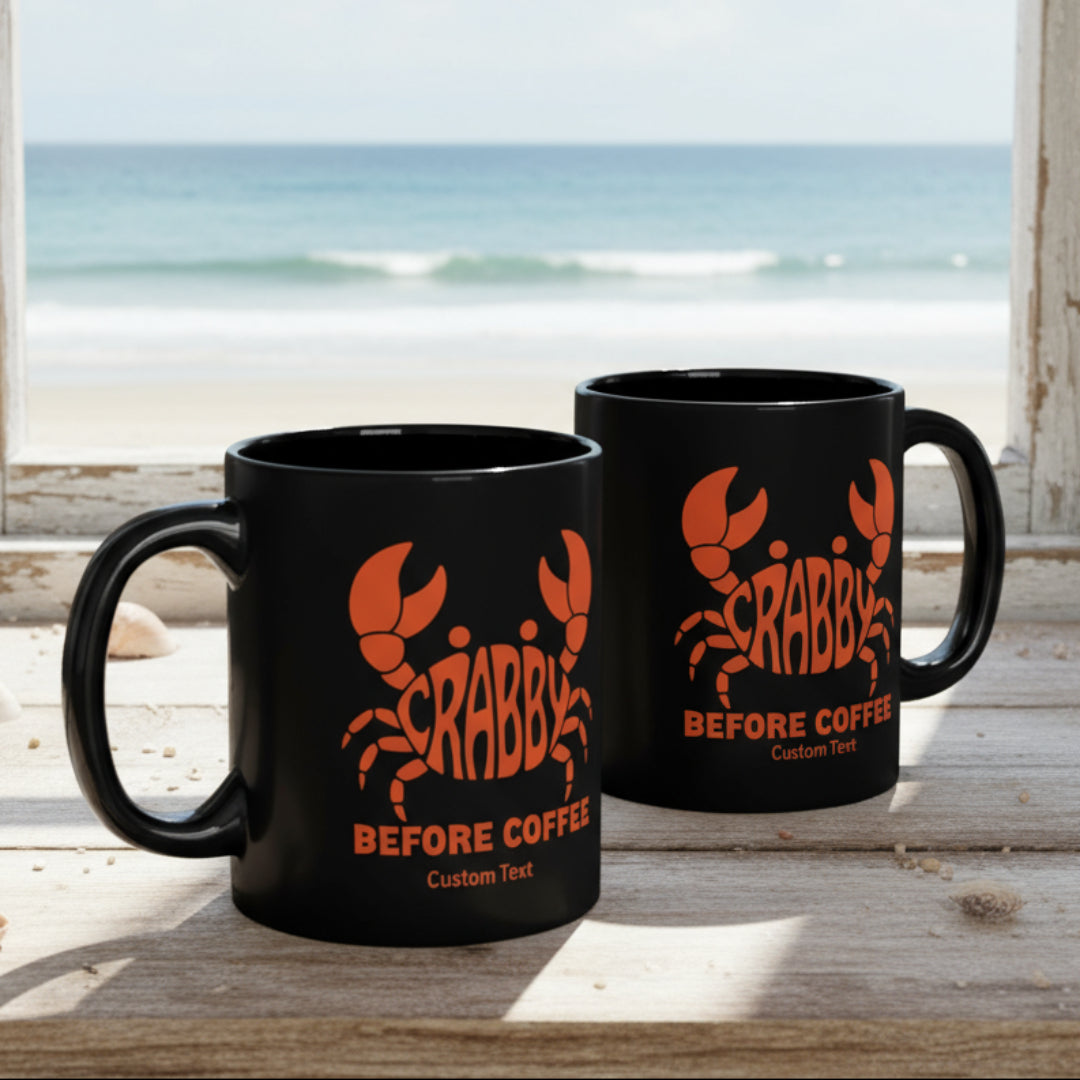 Two black mugs with crab and text 'Crabby Before Coffee' that can be personalized.