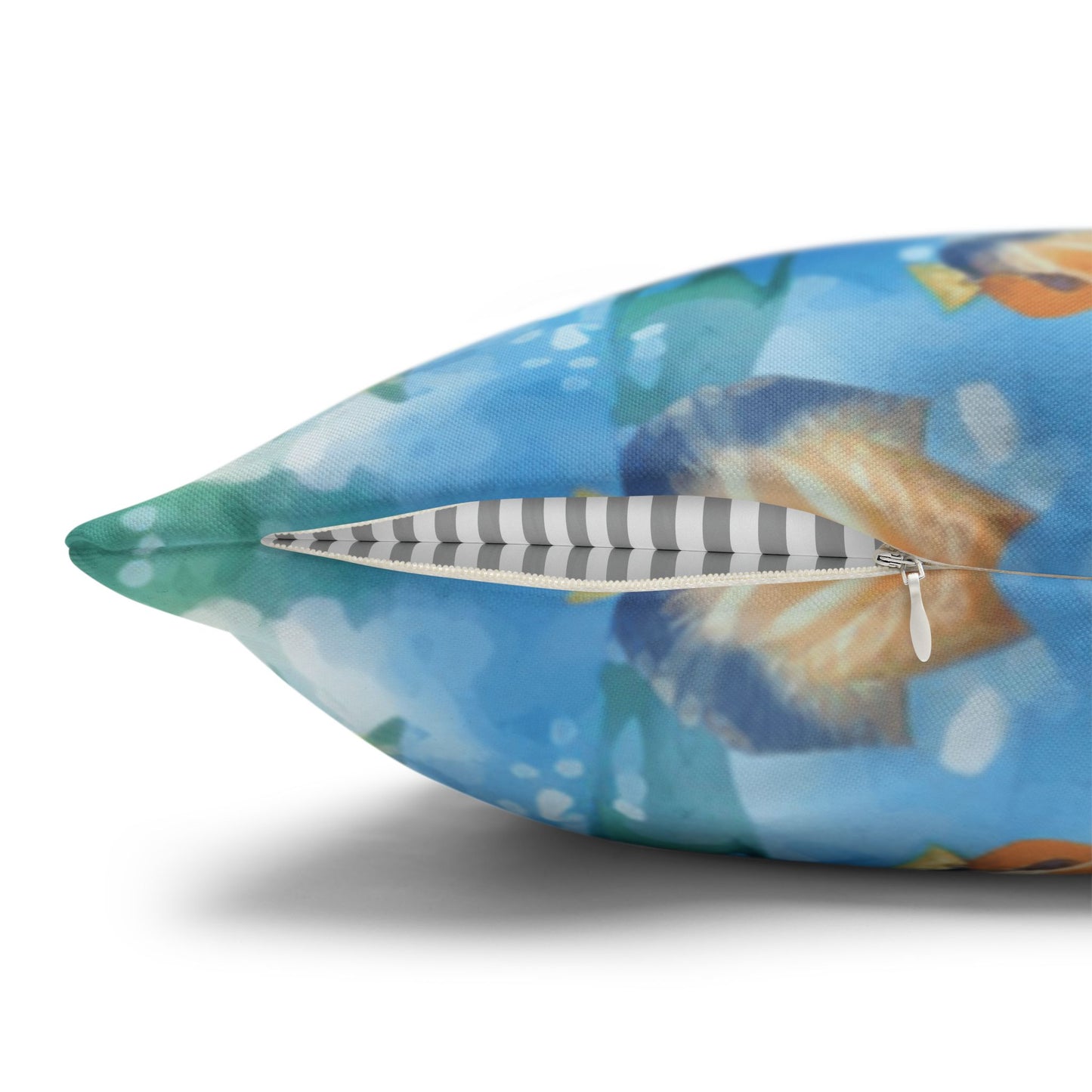 Decorative pillow cover with a watercolor design of two dolphins in the water with flowers along the bottom edges showing the concealed zipper.