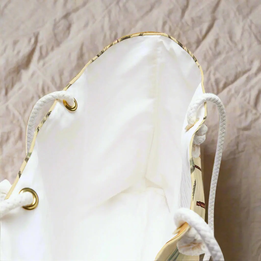 Inside view of our Vintage Beach Weekender Tote Bag constructed from a durable material with a rope handle with metal grommets featuring a vintage beach scene.