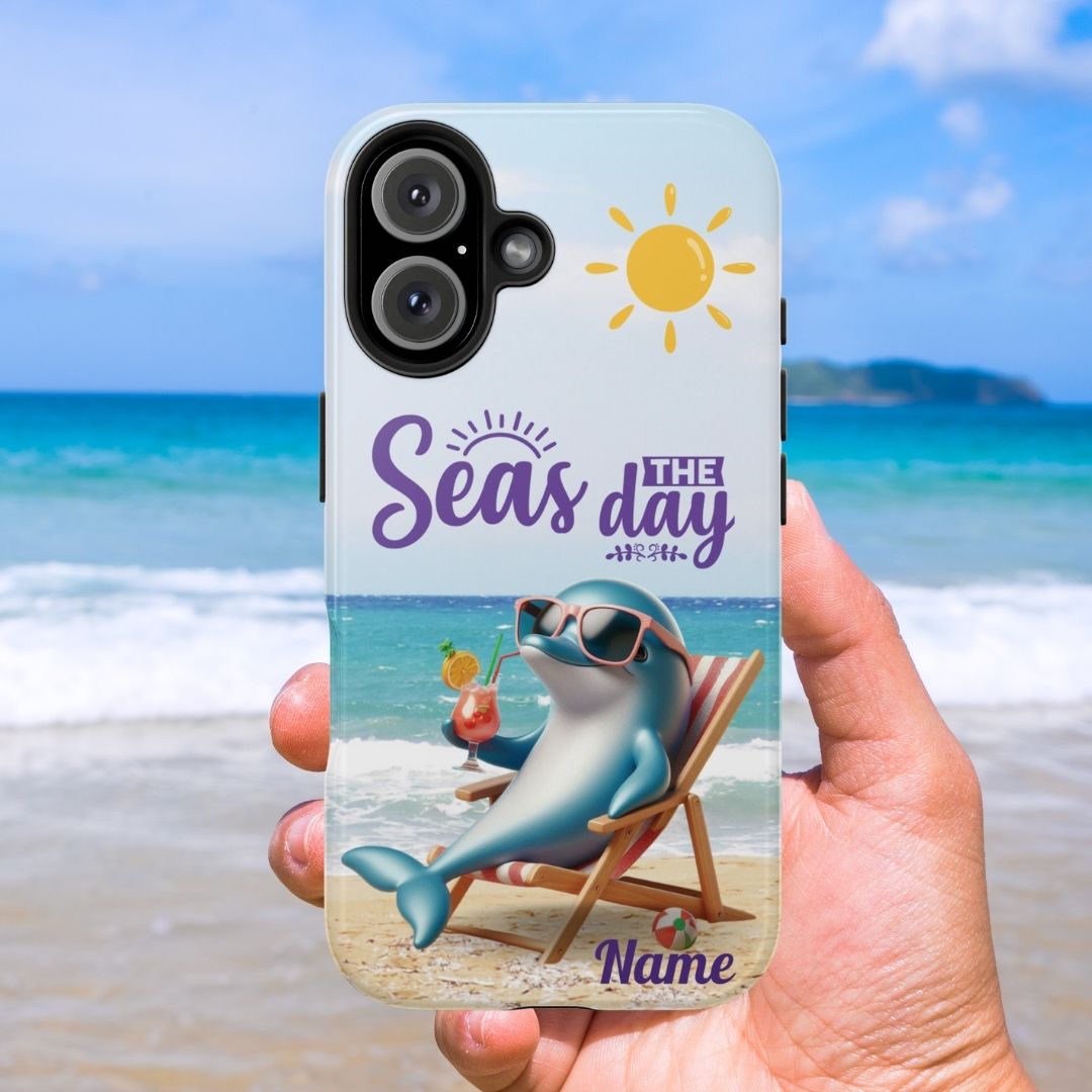Seas the Day dolphin-themed phone case with personalized name, glossy finish, and beach-inspired design with a dolphin enjoying a cocktail during a sunny day on the beach with the phrase Seas the Day.