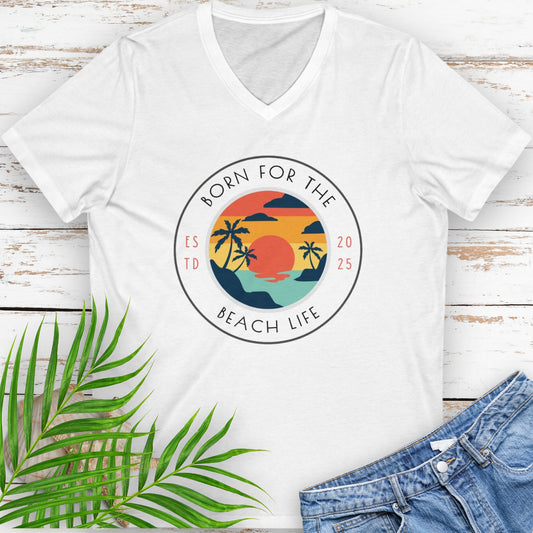 White v-neck t-shirt with circle design with a beach scene and the text “Born for the Beach Life.