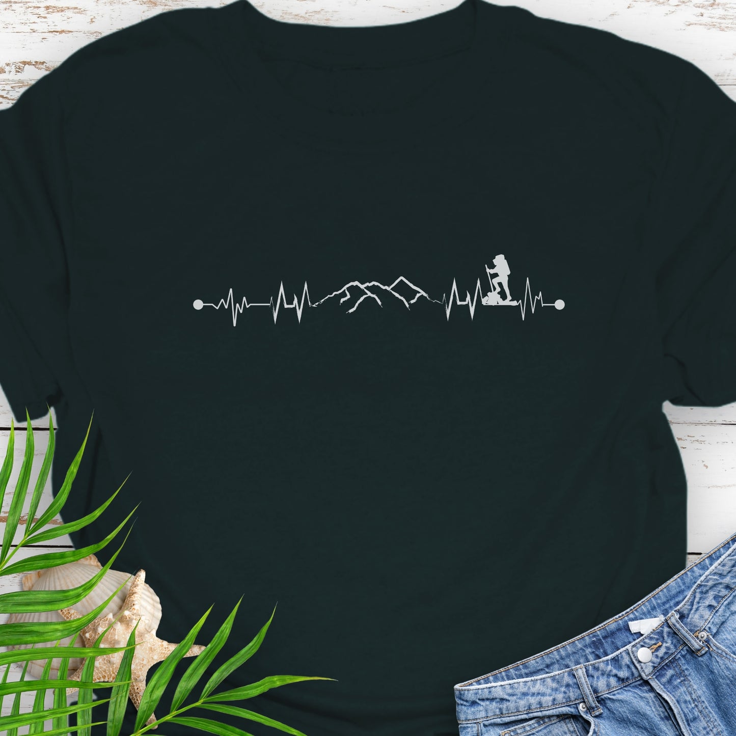 Black t-shirt with a heartbeat line with a mountain range and backpacker.