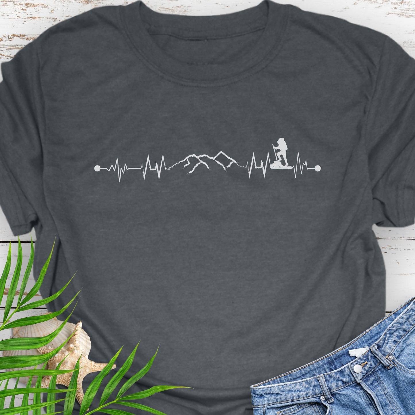 Dark gray t-shirt with a heartbeat line with a mountain range and backpacker.