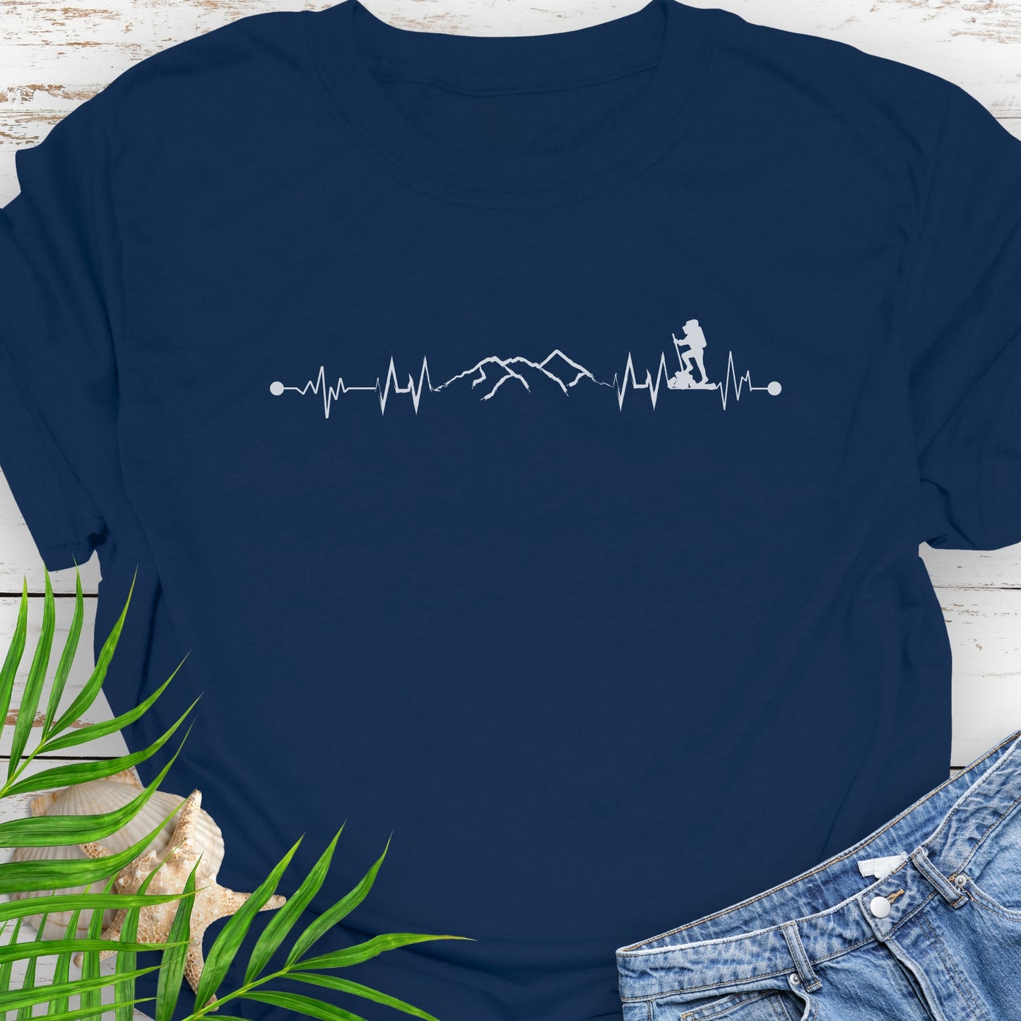 Navy blue t-shirt with a heartbeat line with a mountain range and backpacker.