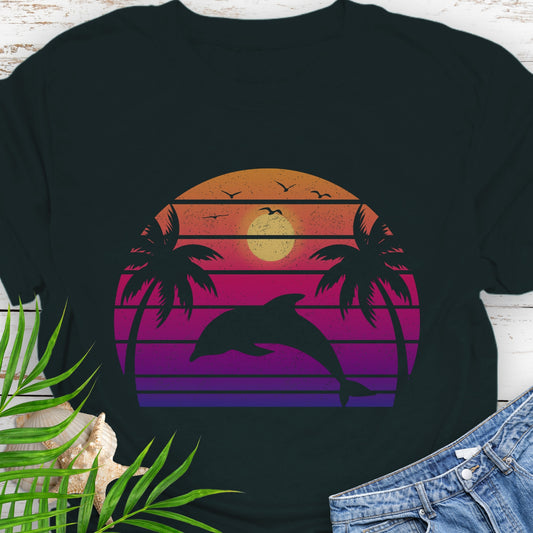 Black T-shirt with a dolphin against a retro sunset and two palm trees.