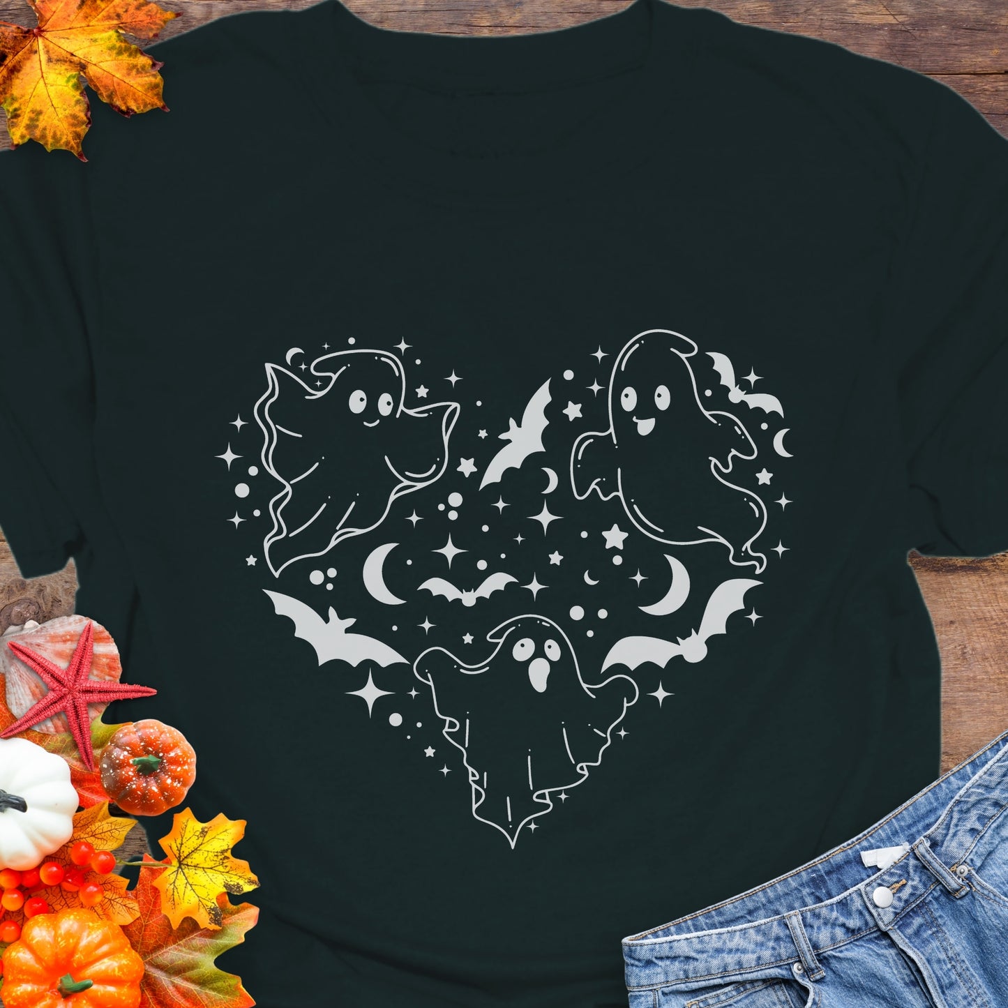 Black unisex T-shirt with a design of white ghosts and black bats forming the shape of a heart.