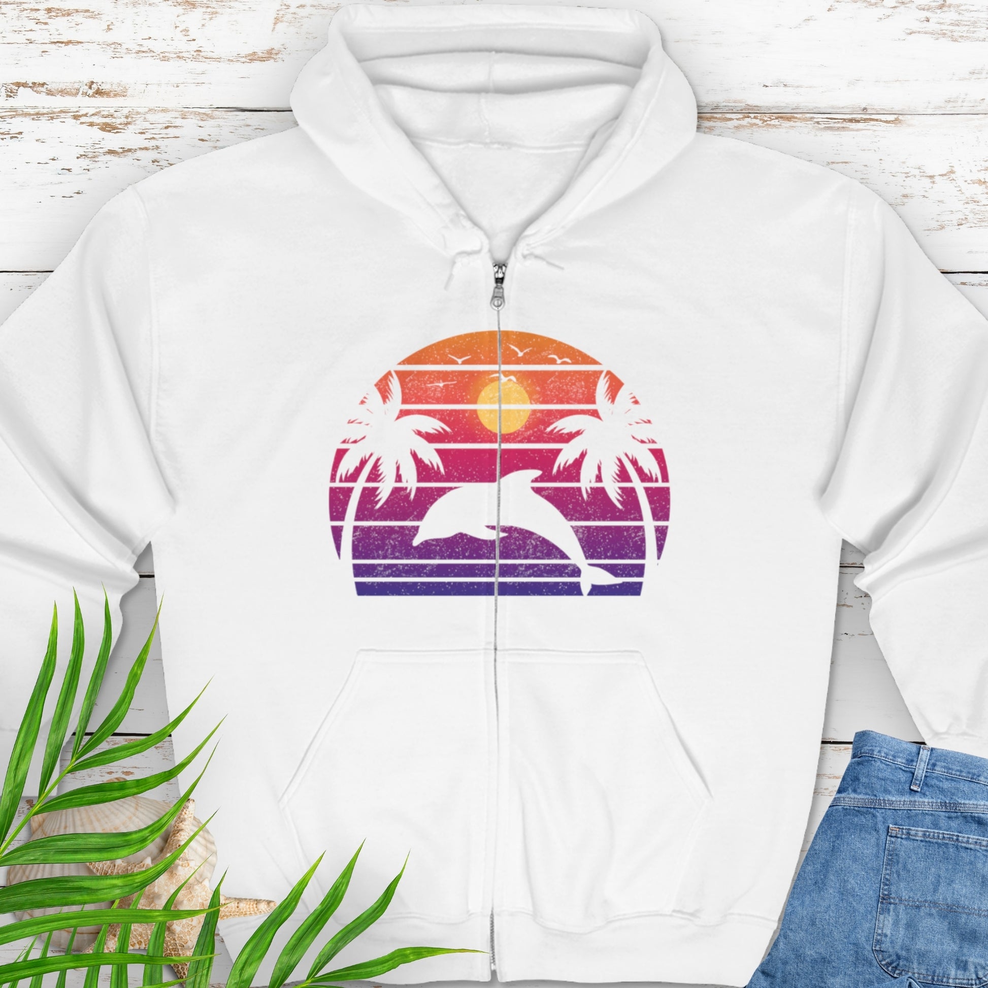 White zipped hooded sweatshirt with a retro sunset dolphin graphic.