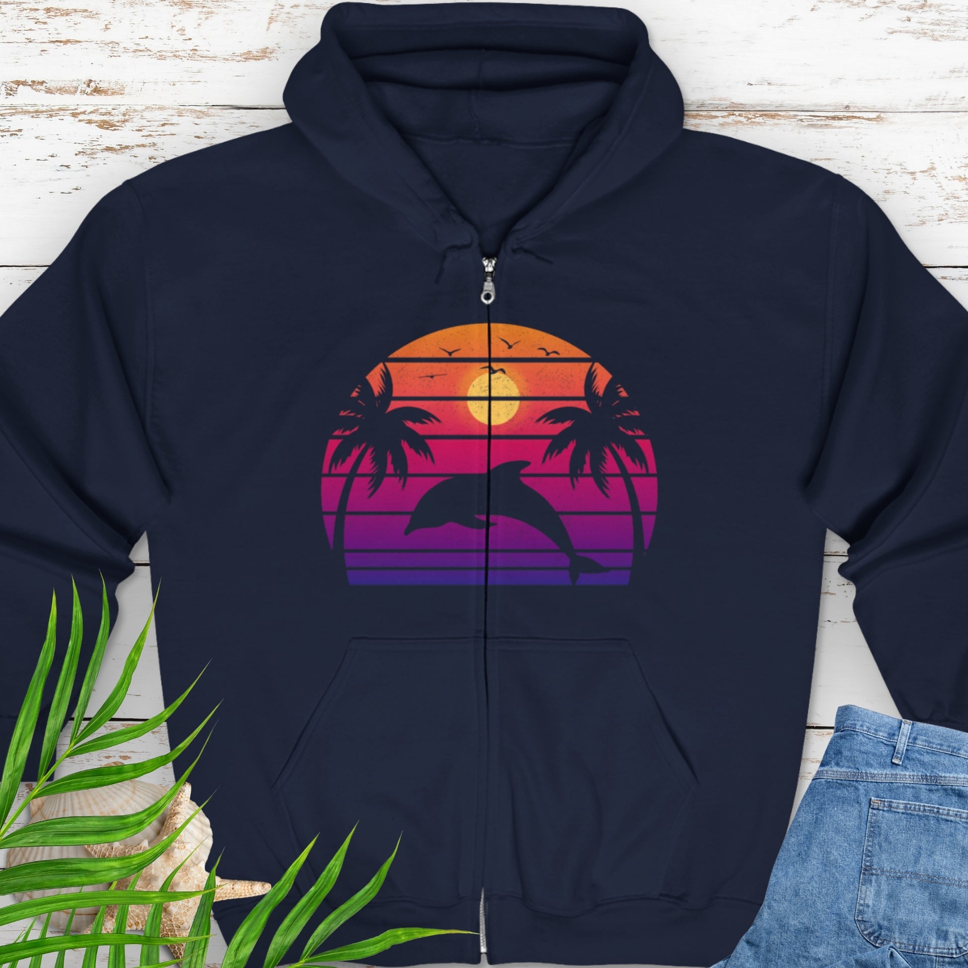 Navy blue zipped hooded sweatshirt with a retro sunset dolphin graphic.