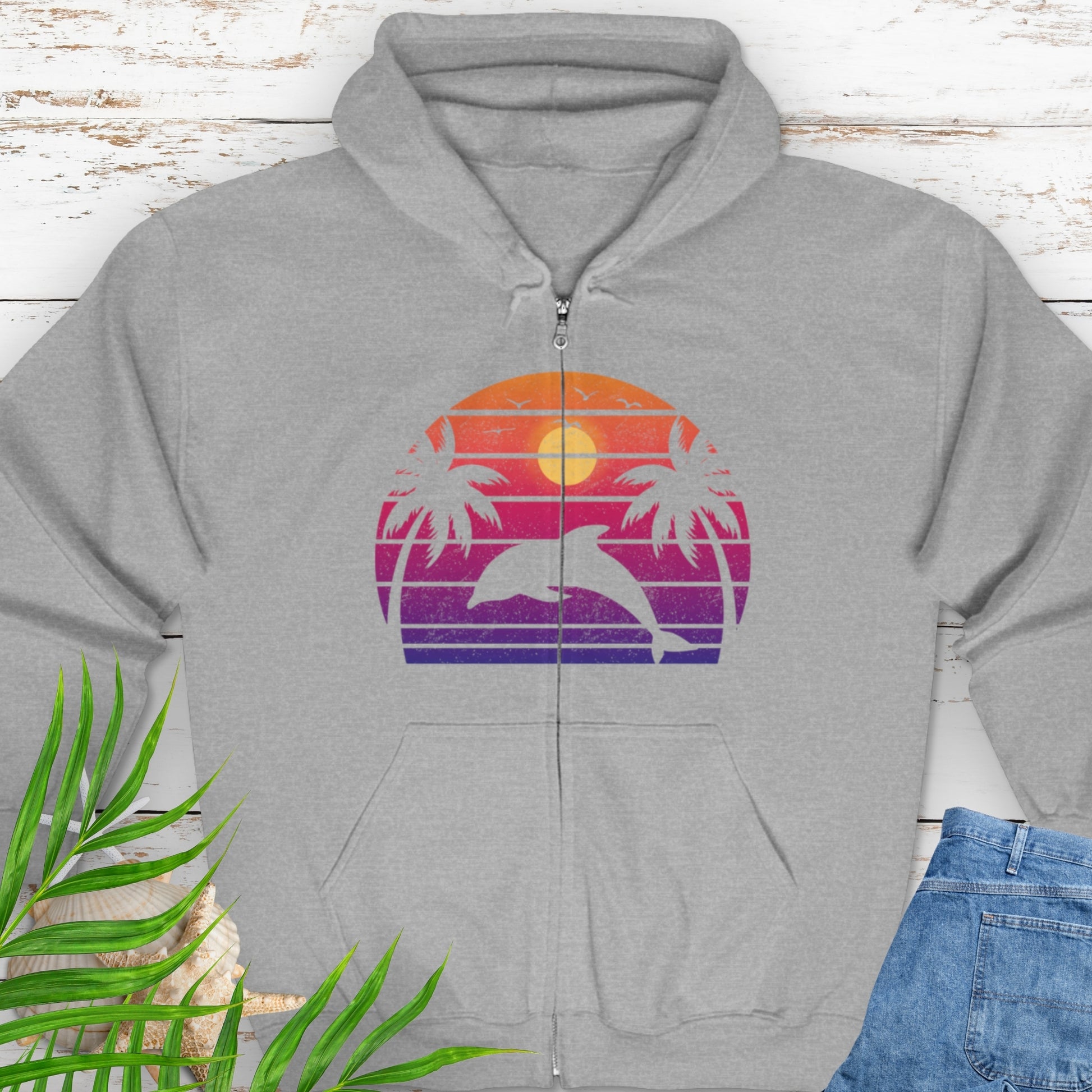 Gray zipped hooded sweatshirt with a retro sunset dolphin graphic.