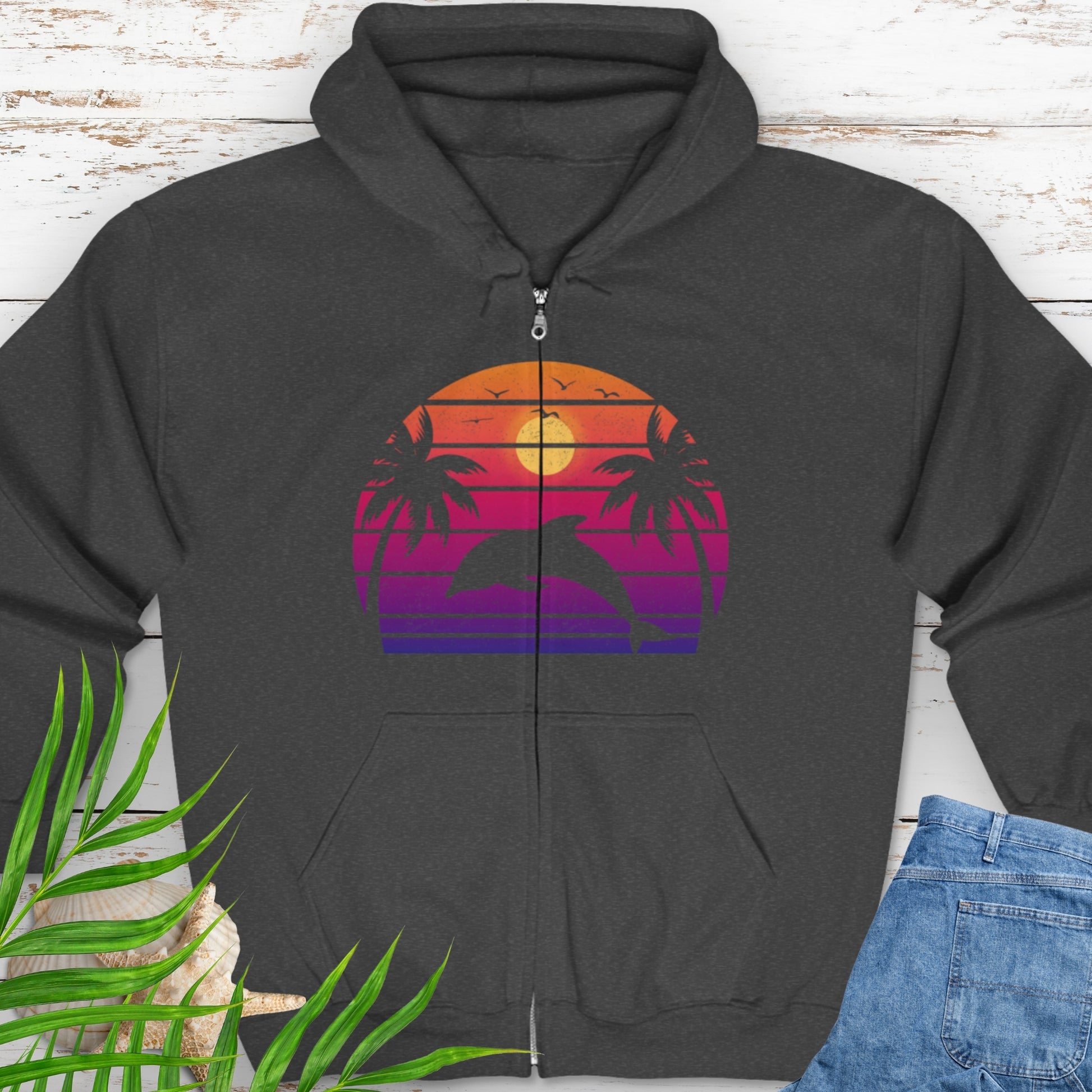 Dark gray zipped hooded sweatshirt with a retro sunset dolphin graphic.