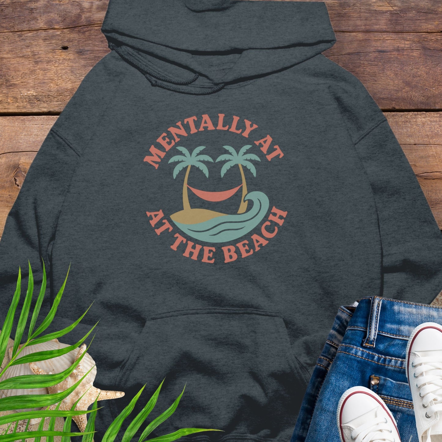 Dark gray hoodie Mentally at the Beach retro with palm trees and hammock design.
