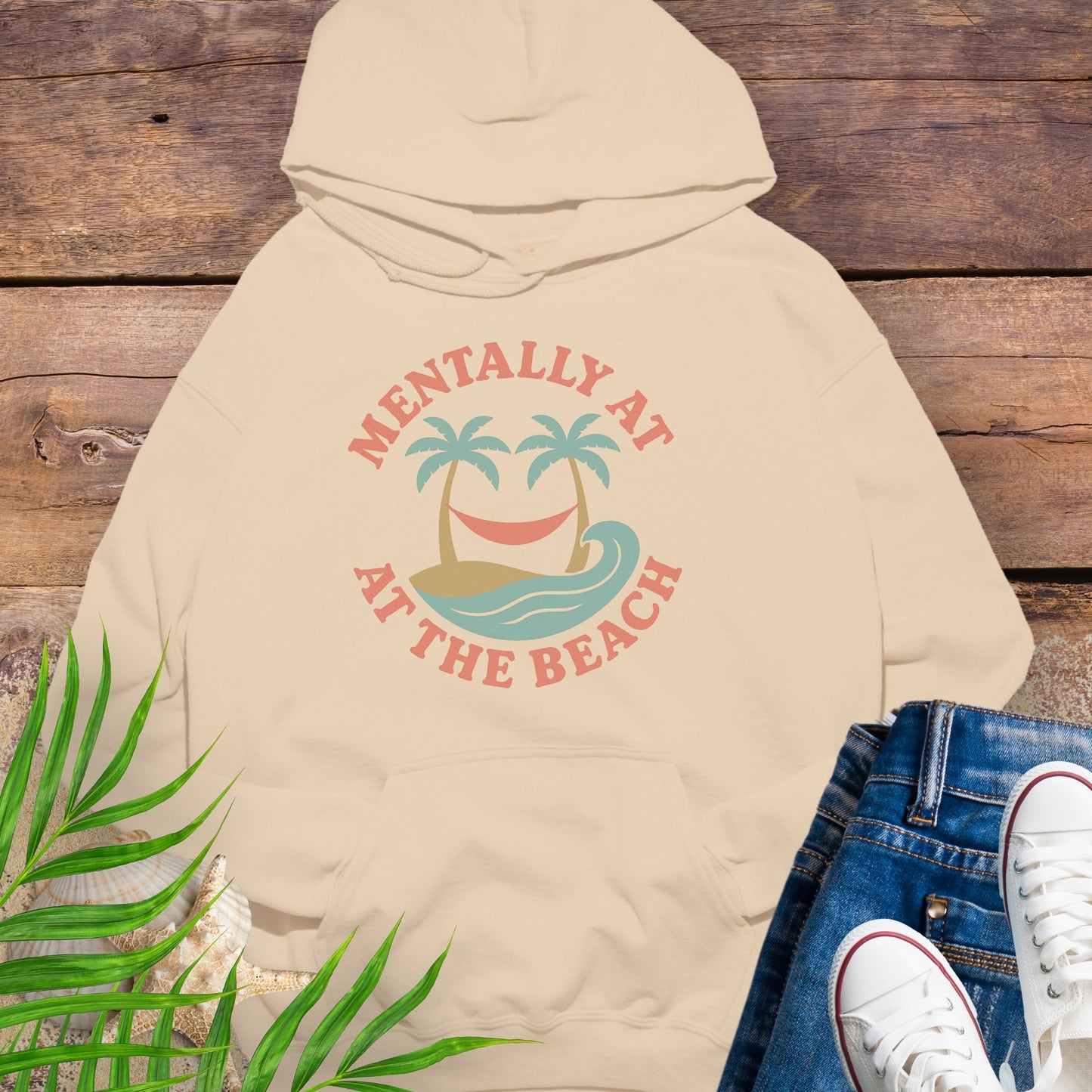 Beige hoodie Mentally at the Beach retro with palm trees and hammock design.