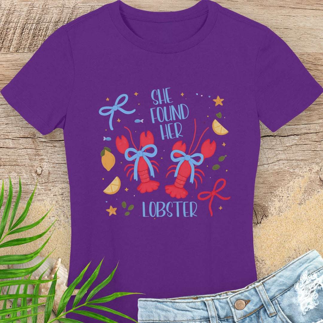 Purple woman's t-shirt with colorful lobster design and text She Found Her Lobster.