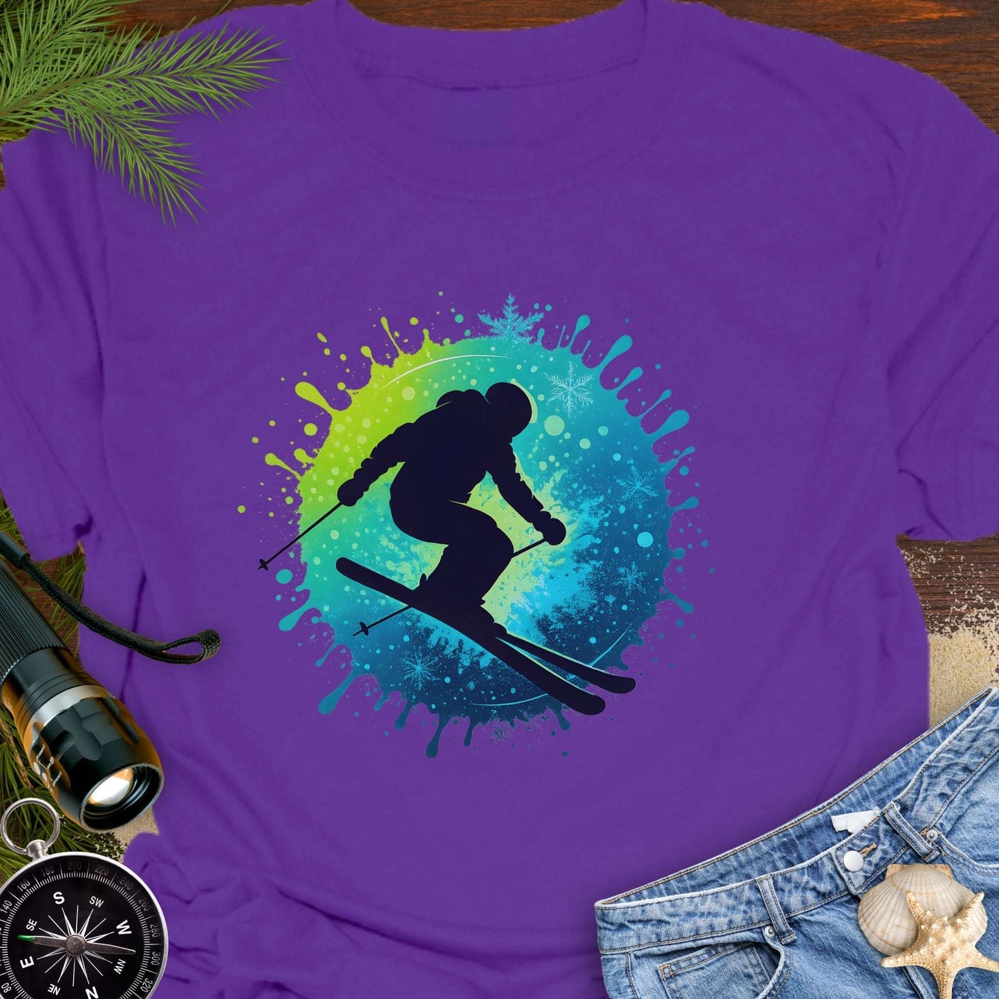 Purple t-shirt with a skier graphic.