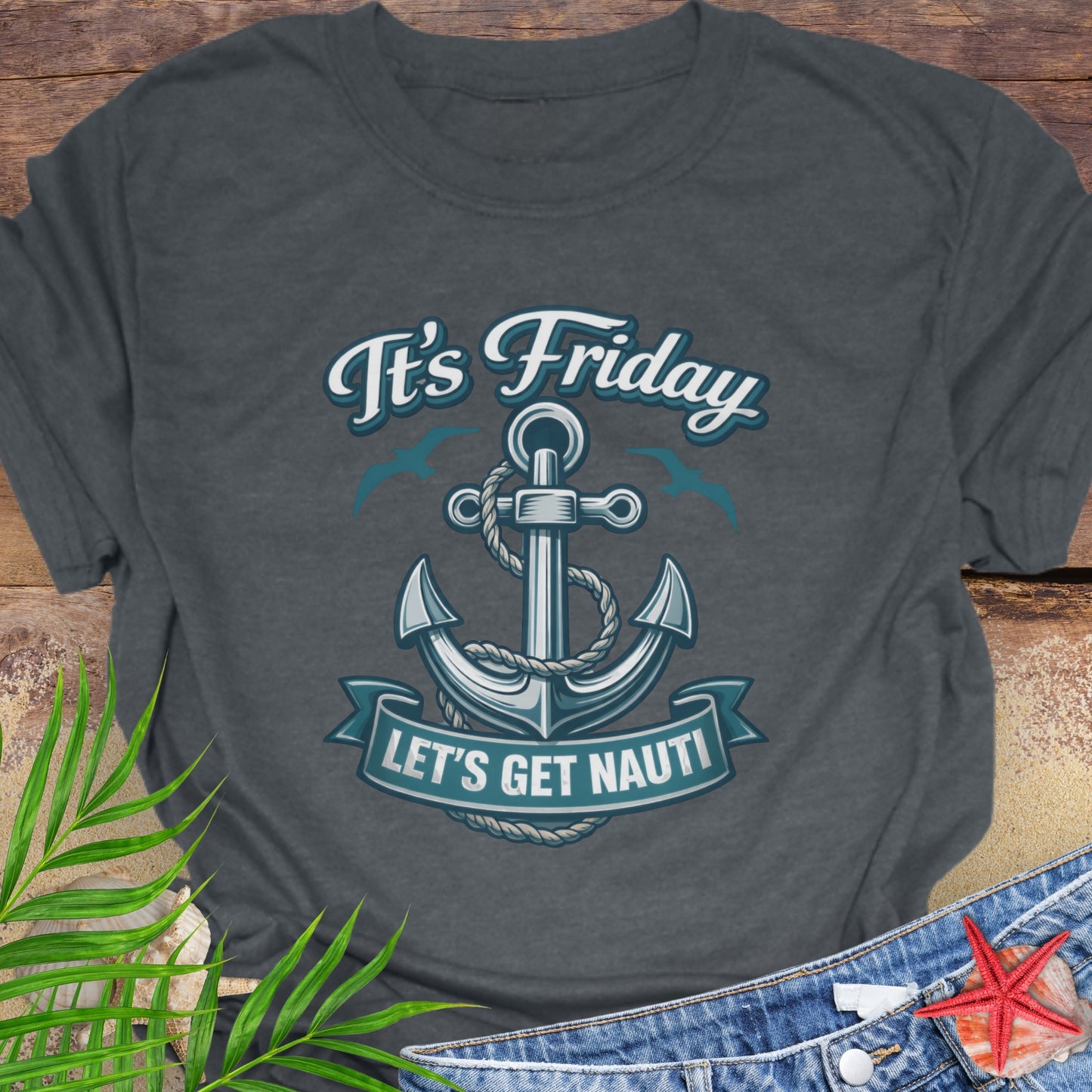 Gray unisex t-shirt with a nautical anchor design and text “It’s Friday Let’s Get Nauti”.