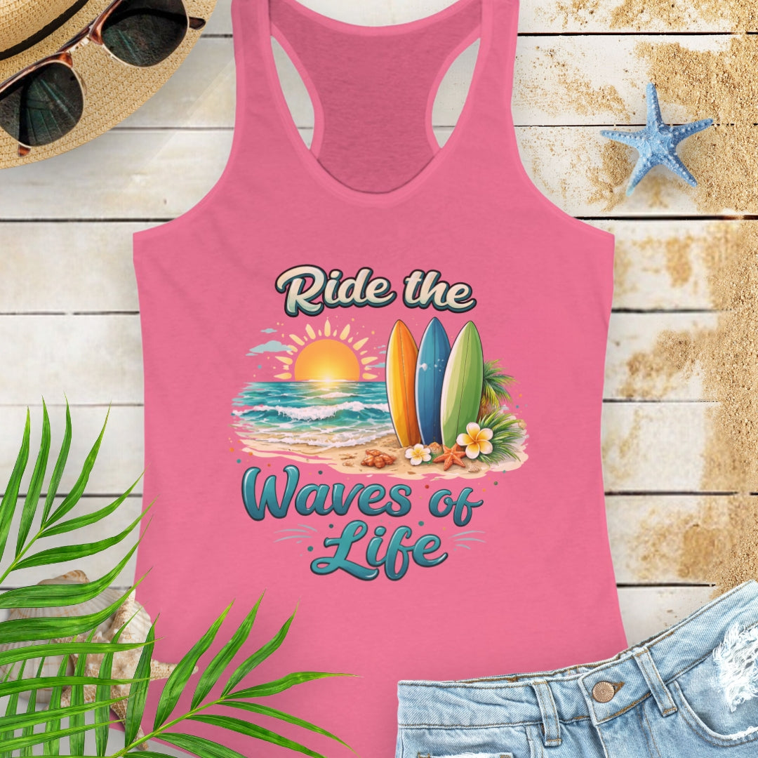 Hot Pink Women's racerback tank top with a scooped neckline, side seams for a fitted silhouette, and lightweight cotton-poly fabric. Features the 'Ride the Waves of Life' beach graphic on the front.