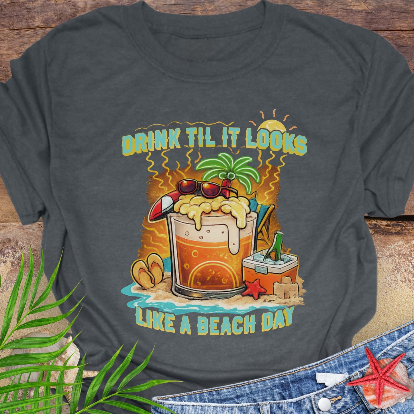 Gray t-shirt with tropical graphic t-shirt featuring a green parrot surfing with sunglasses, holding a beer, with coconut drink and sunset palms; text reads “Flippin’ the Bird (to responsibility)”.