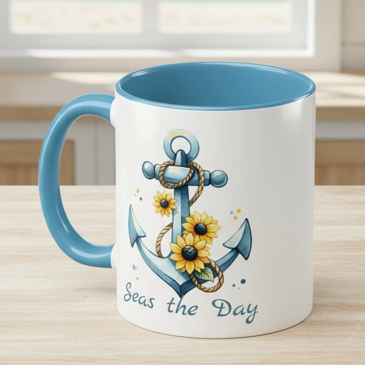 11 oz White mug with baby blue handle and interior with Anchor and Sunflowers with text Seas the Day