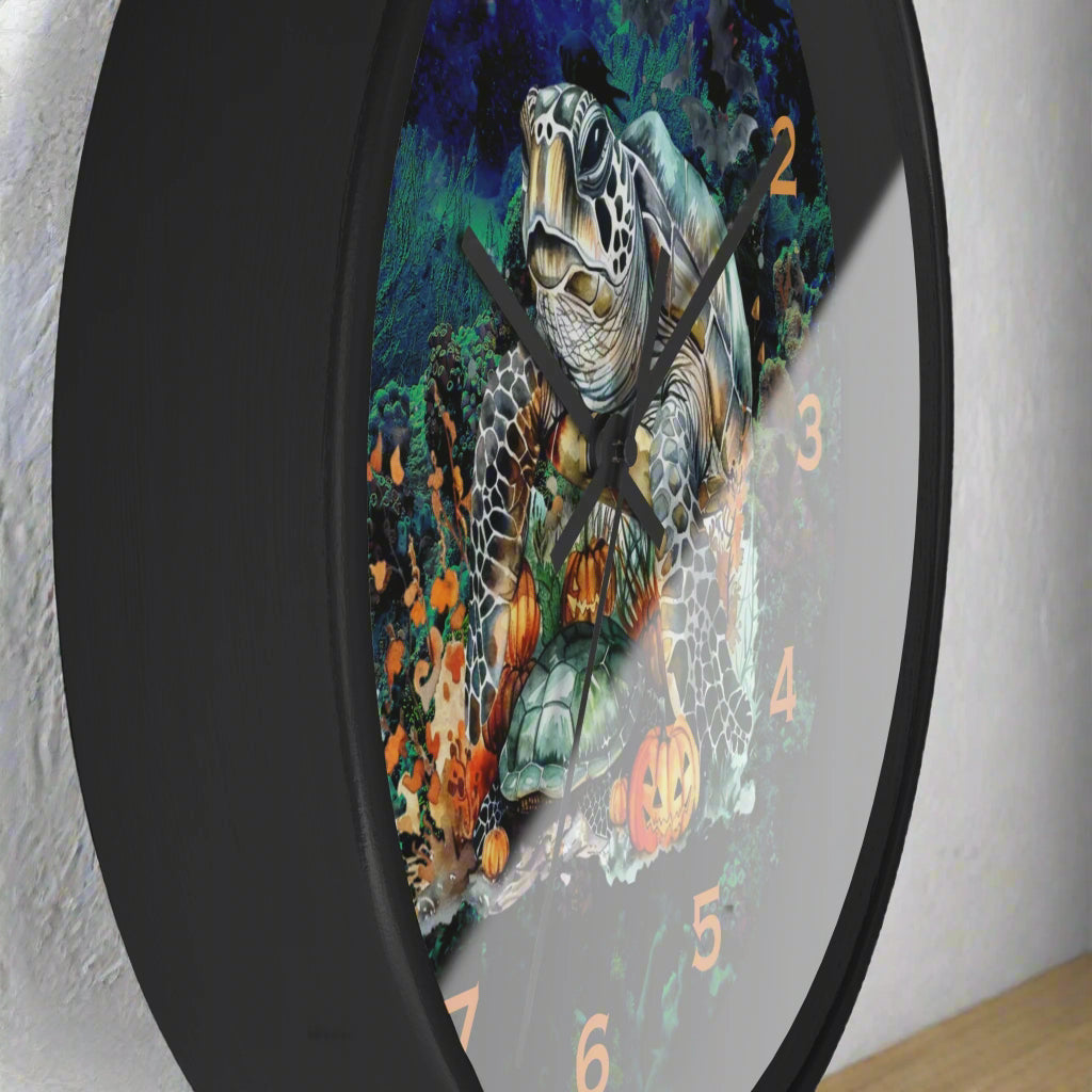 Wall clock with a turtle design on a black background