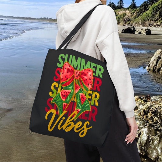 Black 18" x 18" tote bag with the word "Summer" repeated in green, red, and yellow, featuring a coquette-style bow, watermelon illustrations, and the word "Vibes" underneath.