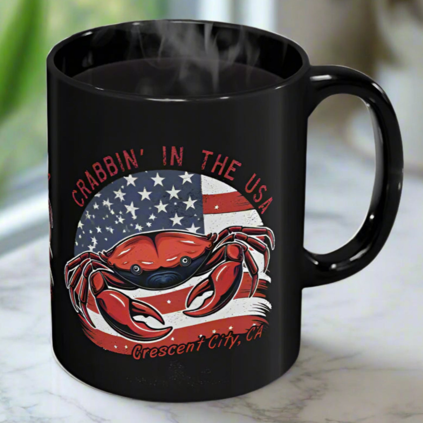 Black mug with a red crab design and American flag with Crescent City, CA below.